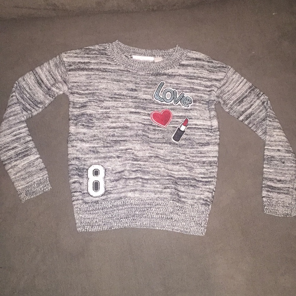 Cute little girls sweater with appliqué designs